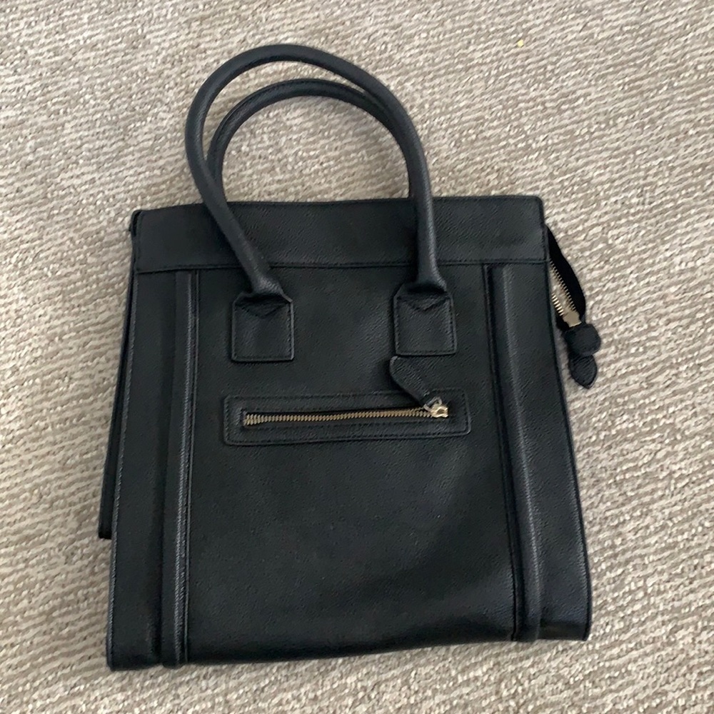 Black leather tote handbag.